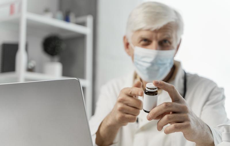 male-doctor-his-desk-with-some-medicine.jpg