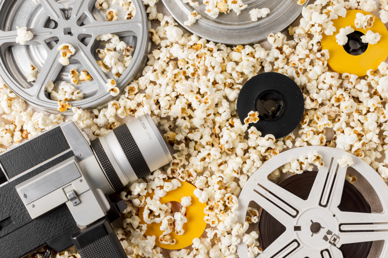 overhead-view-film-reel-vintage-camcorder-film-reels-popcorn.jpg